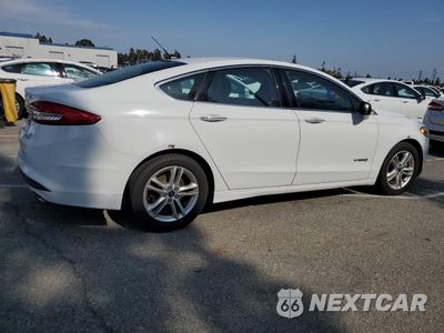 Trzecie zdjęcie samochodu z tyłu: 2018 FORD FUSION SE HYBRID VIN:3FA6P0LU0JR278635 - miniatura