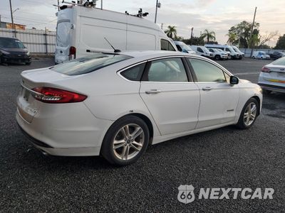 Trzecie zdjęcie samochodu z tyłu: 2018 FORD FUSION SE HYBRID VIN:3FA6P0LU2JR163521 - miniatura