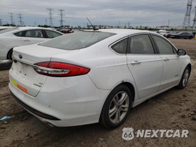 Trzecie zdjęcie samochodu z tyłu: 2018 FORD FUSION SE HYBRID VIN:3FA6P0LU9JR172068 - miniatura