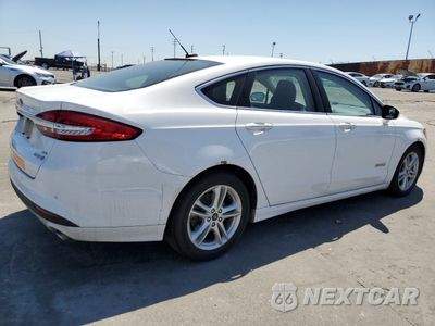 Trzecie zdjęcie samochodu z tyłu: 2018 FORD FUSION SE HYBRID VIN:3FA6P0LU5JR129962 - miniatura