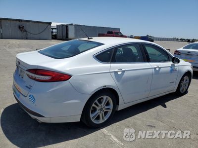 Trzecie zdjęcie samochodu z tyłu: 2018 FORD FUSION SE HYBRID VIN:3FA6P0LU6JR171542 - miniatura