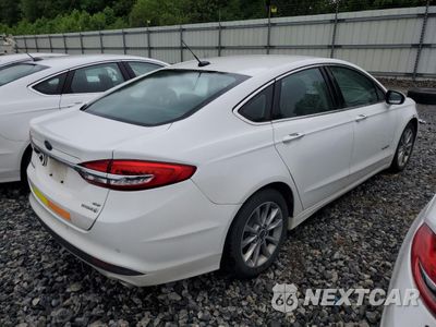 Trzecie zdjęcie samochodu z tyłu: 2017 FORD FUSION SE HYBRID VIN:3FA6P0LU6HR409271 - miniatura