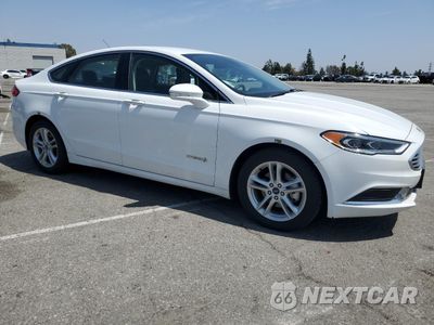 Czwarte zdjęcie samochodu z boku: 2018 FORD FUSION SE HYBRID VIN:3FA6P0LU3JR152463 - miniatura