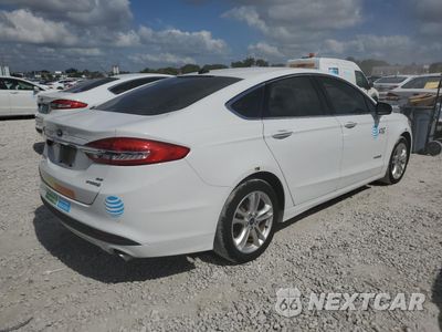 Trzecie zdjęcie samochodu z tyłu: 2018 FORD FUSION SE HYBRID VIN:3FA6P0LU0JR278702 - miniatura