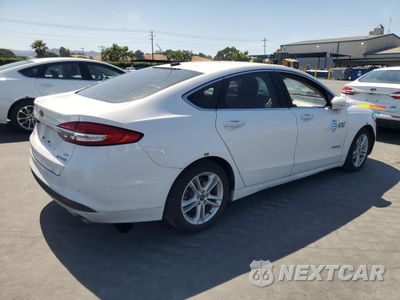 Trzecie zdjęcie samochodu z tyłu: 2018 FORD FUSION SE HYBRID VIN:3FA6P0LU1JR118666 - miniatura