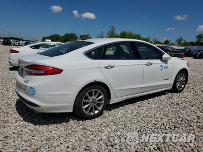 Trzecie zdjęcie samochodu z tyłu: 2017 FORD FUSION SE HYBRID VIN:3FA6P0LUXHR409077 - miniatura