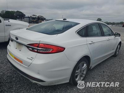 Trzecie zdjęcie samochodu z tyłu: 2018 FORD FUSION SE HYBRID VIN:3FA6P0LU0JR118691 - miniatura