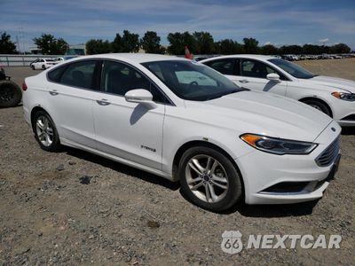 Czwarte zdjęcie samochodu z boku: 2018 FORD FUSION SE HYBRID VIN:3FA6P0LU9JR129835 - miniatura