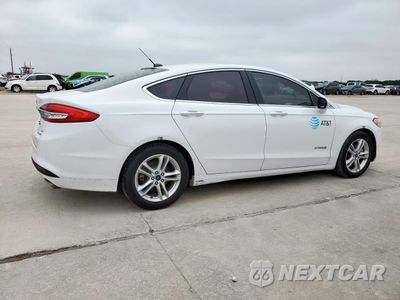 Trzecie zdjęcie samochodu z tyłu: 2018 FORD FUSION SE HYBRID VIN:3FA6P0LU6JR171881 - miniatura