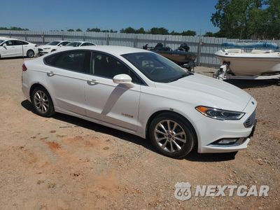 Czwarte zdjęcie samochodu z boku: 2017 FORD FUSION SE HYBRID VIN:3FA6P0LU2HR409624 - miniatura