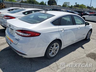 Trzecie zdjęcie samochodu z tyłu: 2018 FORD FUSION SE HYBRID VIN:3FA6P0LU7JR171565 - miniatura