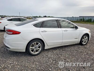 Trzecie zdjęcie samochodu z tyłu: 2018 FORD FUSION SE HYBRID VIN:3FA6P0LU8JR171638 - miniatura