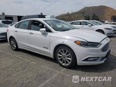 Czwarte zdjęcie samochodu z boku: 2017 FORD FUSION SE HYBRID VIN:3FA6P0LU0HR409749 - miniatura