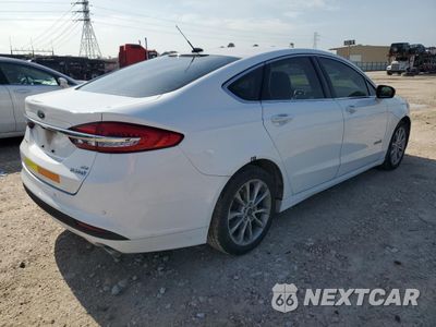 Trzecie zdjęcie samochodu z tyłu: 2017 FORD FUSION SE HYBRID VIN:3FA6P0LU1HR409033 - miniatura