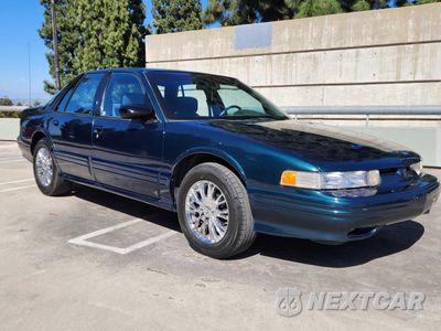 1995 OLDSMOBILE CUTLASS SUPREME SL 1G3WH52M6SD334609 - główne zdjęcie licytacji z USA - miniatura