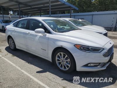 Czwarte zdjęcie samochodu z boku: 2017 FORD FUSION SE HYBRID VIN:3FA6P0LUXHR409371 - miniatura