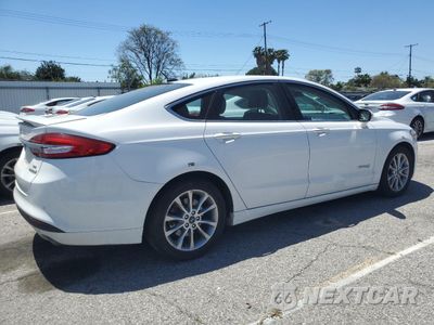 Trzecie zdjęcie samochodu z tyłu: 2017 FORD FUSION SE HYBRID VIN:3FA6P0LUXHR409726 - miniatura