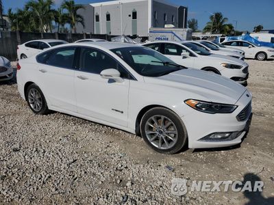Czwarte zdjęcie samochodu z boku: 2017 FORD FUSION SE HYBRID VIN:3FA6P0LU3HR359574 - miniatura