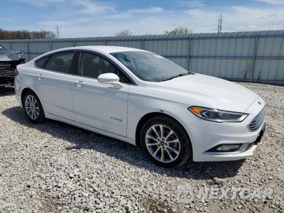 Czwarte zdjęcie samochodu z boku: 2017 FORD FUSION SE HYBRID VIN:3FA6P0LU1HR409209 - miniatura