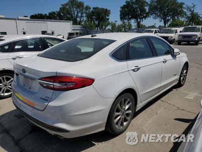Trzecie zdjęcie samochodu z tyłu: 2017 FORD FUSION SE HYBRID VIN:3FA6P0LU7HR409439 - miniatura