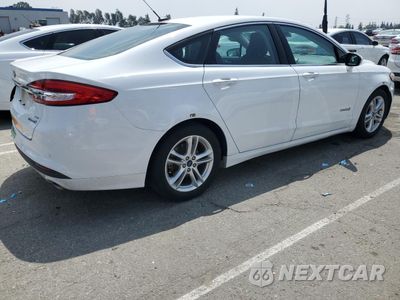 Trzecie zdjęcie samochodu z tyłu: 2018 FORD FUSION SE HYBRID VIN:3FA6P0LUXJR172130 - miniatura