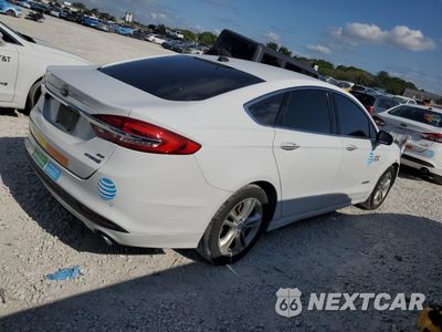 Trzecie zdjęcie samochodu z tyłu: 2018 FORD FUSION SE HYBRID VIN:3FA6P0LU0JR171729 - miniatura