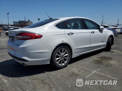 Trzecie zdjęcie samochodu z tyłu: 2017 FORD FUSION SE HYBRID VIN:3FA6P0LU3HR409325 - miniatura