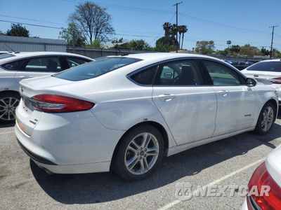 Trzecie zdjęcie samochodu z tyłu: 2018 FORD FUSION SE HYBRID VIN:3FA6P0LU3JR118863 - miniatura