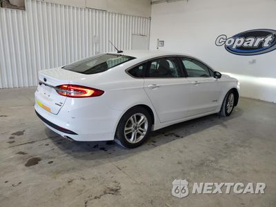 Trzecie zdjęcie samochodu z tyłu: 2018 FORD FUSION SE HYBRID VIN:3FA6P0LU4JR171832 - miniatura