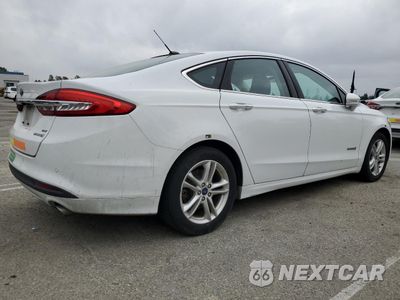 Trzecie zdjęcie samochodu z tyłu: 2018 FORD FUSION SE HYBRID VIN:3FA6P0LU6JR278638 - miniatura
