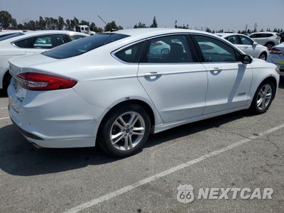 Trzecie zdjęcie samochodu z tyłu: 2018 FORD FUSION SE HYBRID VIN:3FA6P0LU9JR172118 - miniatura