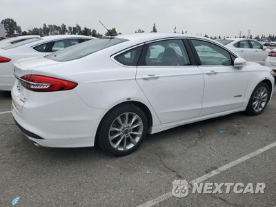 Trzecie zdjęcie samochodu z tyłu: 2017 FORD FUSION SE HYBRID VIN:3FA6P0LU2HR409154 - miniatura