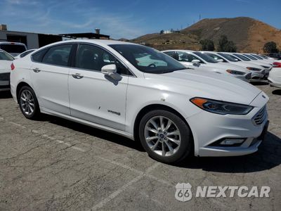 Czwarte zdjęcie samochodu z boku: 2017 FORD FUSION SE HYBRID VIN:3FA6P0LU0HR409752 - miniatura