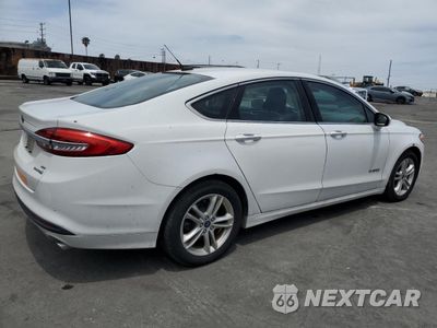 Trzecie zdjęcie samochodu z tyłu: 2018 FORD FUSION SE HYBRID VIN:3FA6P0LU5JR278730 - miniatura