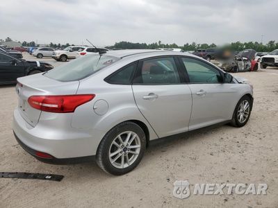 Trzecie zdjęcie samochodu z tyłu: 2018 FORD FOCUS SE VIN:1FADP3F20JL207047 - miniatura