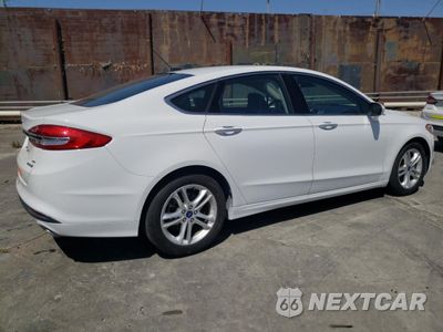 Trzecie zdjęcie samochodu z tyłu: 2018 FORD FUSION SE HYBRID VIN:3FA6P0LU0JR172105 - miniatura