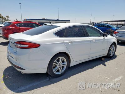 Trzecie zdjęcie samochodu z tyłu: 2018 FORD FUSION SE HYBRID VIN:3FA6P0LU5JR129802 - miniatura