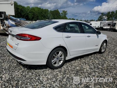 Trzecie zdjęcie samochodu z tyłu: 2018 FORD FUSION SE HYBRID VIN:3FA6P0LU1JR261598 - miniatura