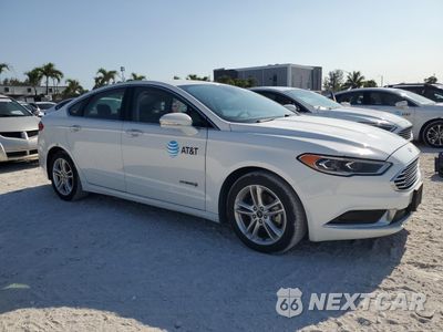 Czwarte zdjęcie samochodu z boku: 2018 FORD FUSION SE HYBRID VIN:3FA6P0LU4JR278699 - miniatura