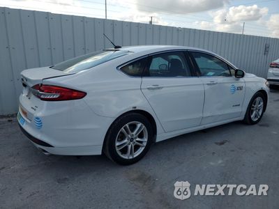 Trzecie zdjęcie samochodu z tyłu: 2018 FORD FUSION SE HYBRID VIN:3FA6P0LU1JR278708 - miniatura