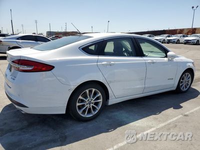 Trzecie zdjęcie samochodu z tyłu: 2017 FORD FUSION SE HYBRID VIN:3FA6P0LU5HR409729 - miniatura