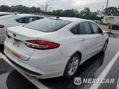 Trzecie zdjęcie samochodu z tyłu: 2018 FORD FUSION SE HYBRID VIN:3FA6P0LU2JR278720 - miniatura