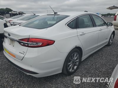 Trzecie zdjęcie samochodu z tyłu: 2017 FORD FUSION SE HYBRID VIN:3FA6P0LU4HR409463 - miniatura