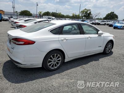 Trzecie zdjęcie samochodu z tyłu: 2017 FORD FUSION SE HYBRID VIN:3FA6P0LU0HR410139 - miniatura