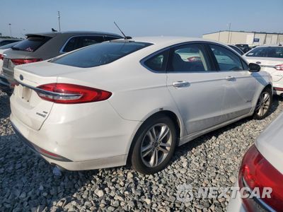 Trzecie zdjęcie samochodu z tyłu: 2018 FORD FUSION SE HYBRID VIN:3FA6P0LU1JR129893 - miniatura