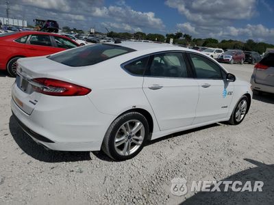 Trzecie zdjęcie samochodu z tyłu: 2018 FORD FUSION SE HYBRID VIN:3FA6P0LU0JR118612 - miniatura
