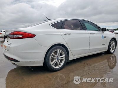 Trzecie zdjęcie samochodu z tyłu: 2018 FORD FUSION SE HYBRID VIN:3FA6P0LU5JR171659 - miniatura