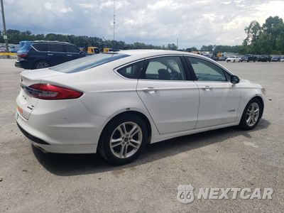 Trzecie zdjęcie samochodu z tyłu: 2018 FORD FUSION SE HYBRID VIN:3FA6P0LUXJR171723 - miniatura