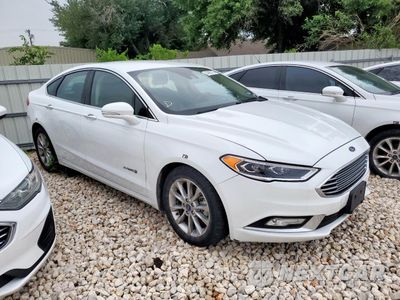 Czwarte zdjęcie samochodu z boku: 2017 FORD FUSION SE HYBRID VIN:3FA6P0LU9HR409295 - miniatura