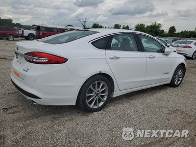 Trzecie zdjęcie samochodu z tyłu: 2017 FORD FUSION SE HYBRID VIN:3FA6P0LU3HR409096 - miniatura